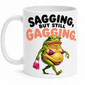 Funny Sagging But Still Gagging Joke Mug, Sagging Frog Character, 11oz Ceramic Coffee Cup Drinkware